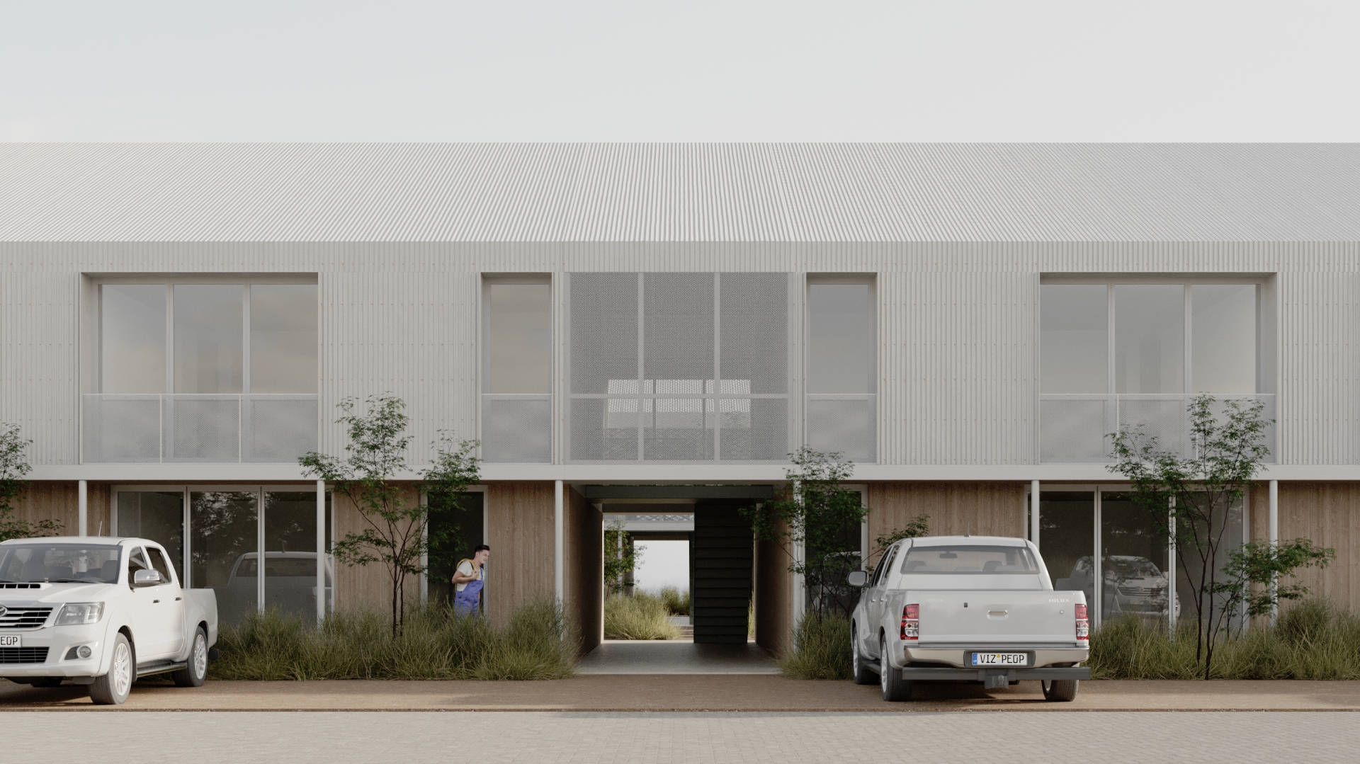 Fachada moderna de viviendas con camionetas estacionadas, parte del desarrollo inmobiliario Nativa Housing en Añelo