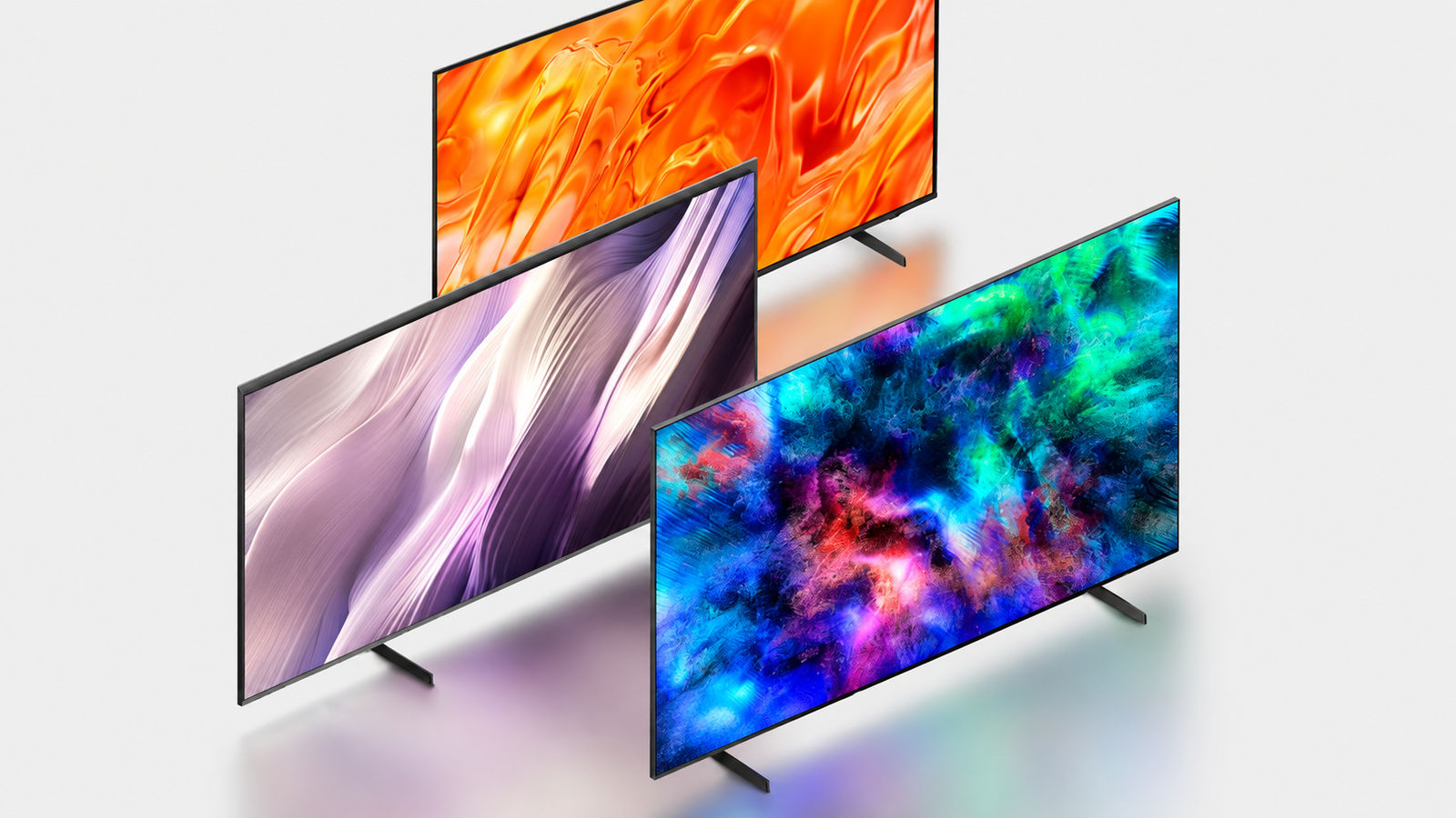 Tres televisores Samsung Vision AI con diferentes tecnologías de pantalla y colores vibrantes